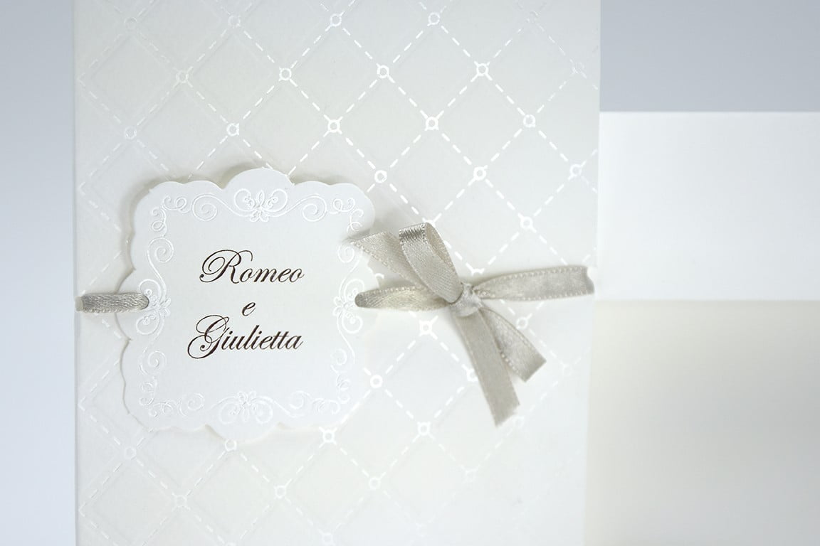 Partecipazione nozze classica carta bianca con rombi