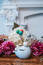 bomboniera coniglio in resina salvadanaio con palloncini