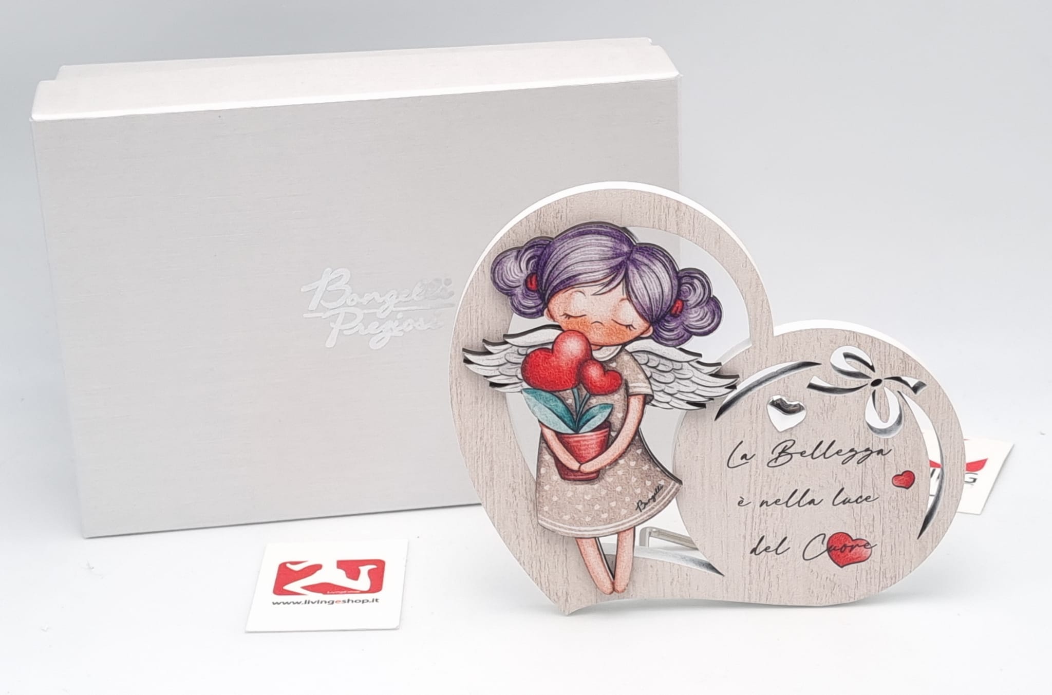 Angelo con piantina in legno  la bellezza è nella luce del cuore
