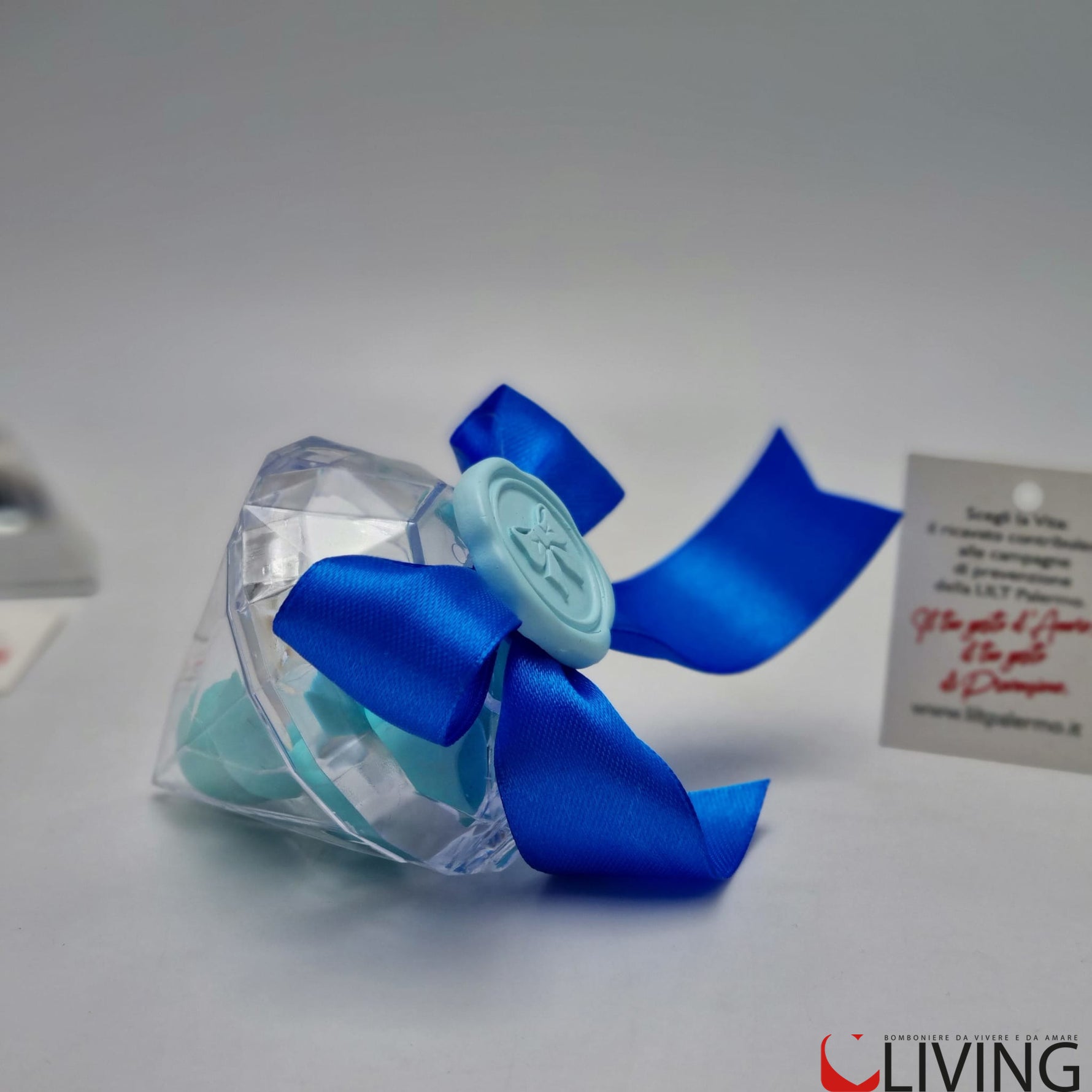 bomboniera linea solidale lilt living diamante plex con applicazione fiocco celeste