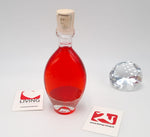 Bottiglia di vetro ovale con liquore di fragoline