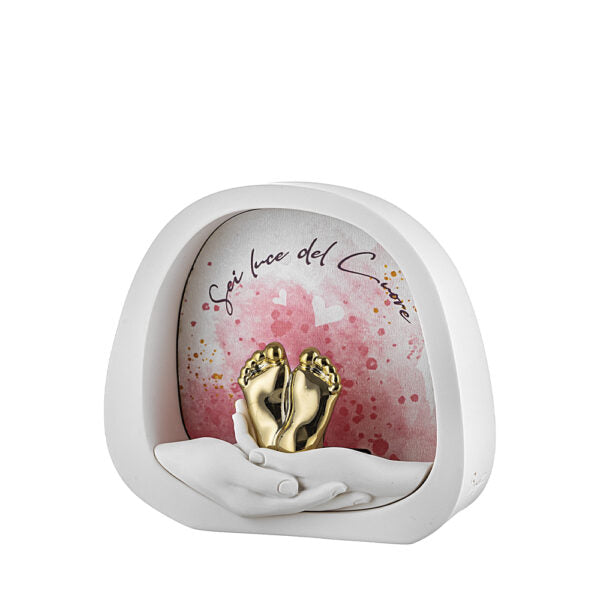 bomboniera lampada led mani con piedini oro sfondo rosa in marmorino