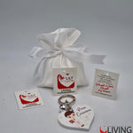 bomboniera linea solidale lilt living sacchetto con portachiavi bimbo comunione
