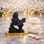 bomboniera scultura bacio stilizzata nera base oro